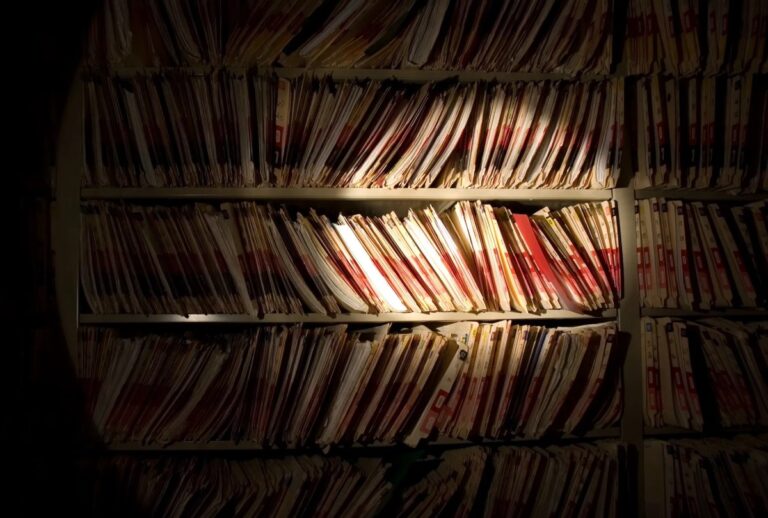 Bookshelves stacked with medical records.