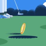 Coin rolling into a golf hole.