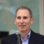 Andy Jassy the CEO of Amazon speaks at the ceremonial ribbon cutting prior to tomorrow's opening night for the NHL's newest hockey franchise the Seattle Kraken at the Climate Pledge Arena on October 22, 2021 in Seattle, Washington